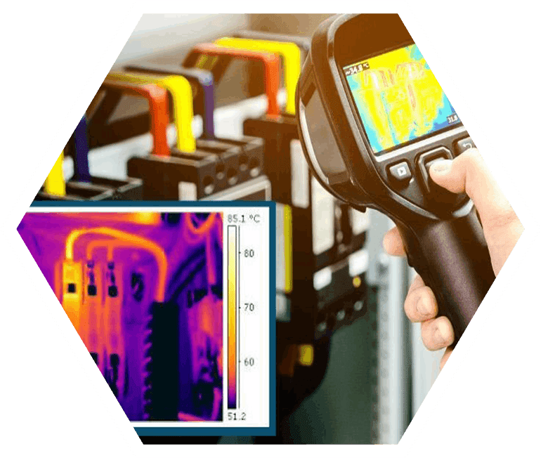 A person is using an infrared camera to check the temperature of pipes.